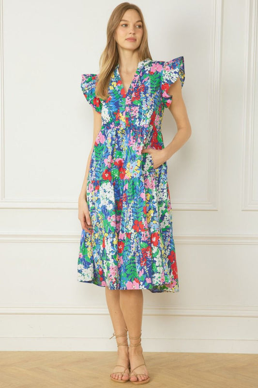 Floral print v-neck ruffle sleeve tiered mini dress. Pockets at side.